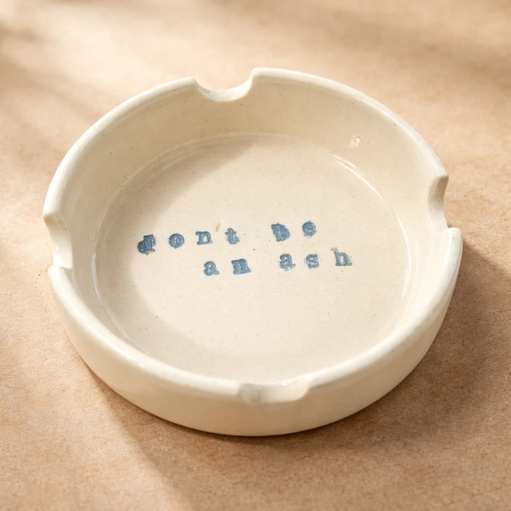 Ashtray featuring a quirky message 'don't be an ash', showcasing unique handmade charm.